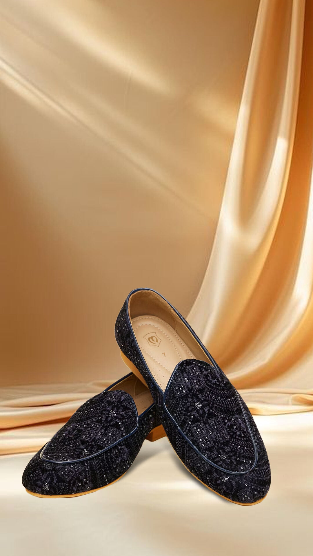 Sophisticated blue jutti adorned with intricate colorful patterns, ideal for festive and wedding wear